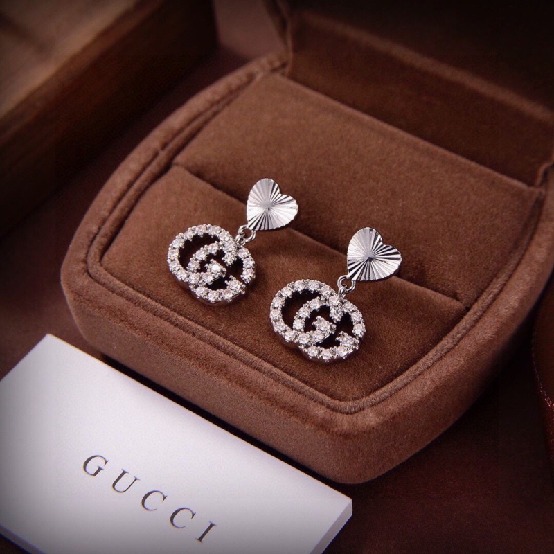 G*u*i earrings